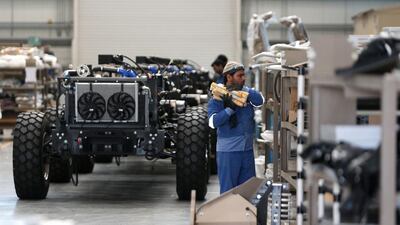 Workers at the NIMR military vehicle production facility in the Tawazun Industrial Park in the Al Ajban area north of Abu Dhabi. Christopher Pike / The National