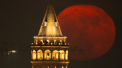 The strawberry Moon rises behind Galata Tower in Istanbul, Turkey, Wednesday, June 11, 2025. (AP Photo / Emrah Gurel)