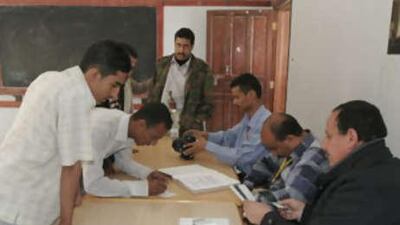 Young Yemenis register their names at the election commission in Sana'a.