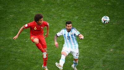 In this file photo from July 5, 2014, Axel Witsel of Belgium and Ezequiel Lavezzi, right, of Argentina compete for the ball during the 2014 World Cup quarter-final match at Estadio Nacional on July 5, 2014 in Brasilia, Brazil. Jamie Squire / Getty Images