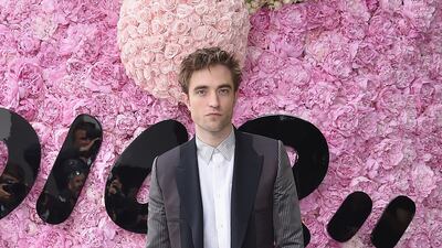Robert Pattinson, in layered Dior, attends the brand's Dior Homme Menswear spring/summer 2019 show as part of Paris Fashion Week on June 23, 2018. Getty Images