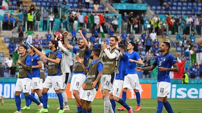 Italy players celebrate in front of the fans inside the Stadio Olimpico after the Euro 2020 win over Wales. Getty Images