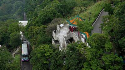 A Peak Tram passes uphill of the Victoria Peak in Hong Kong on June 17, 2021. Vincent Yu / AP Photo