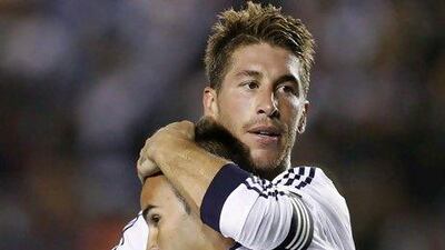 Defender Sergio Ramos, top, expects one or two more additions to the Real Madrid roster in time for the team to start the defence of last year's Primera Liga title.