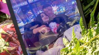 Mourners left a photo of the alleged murder victim at the scene in Ingolstadt, southern Germany. Getty