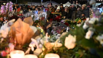 Mourners gather outside the bar to pay their respects to those killed. Getty Images