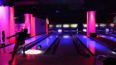 With its dimmed lights and thumping music, the bowling alley at the Bab Ezzouar mall feels like a night club. AFP Photo / Farouk Batiche