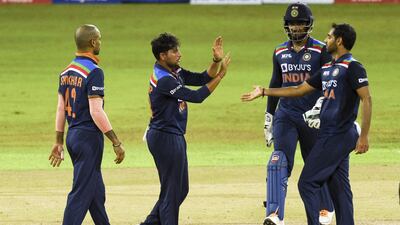 India's Kuldeep Yadav celebrates with his teammate after the dismissal of Sri Lanka's Minod Bhanuka.