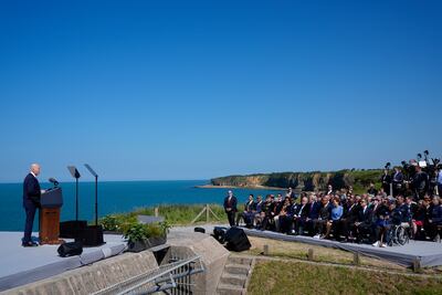 D-Day Veteran John Wardell, bottom right, sits next to US Secretary of State Antony Blinken and Secretary of Defence Lloyd Austin as President Joe Biden delivers a speech. AP