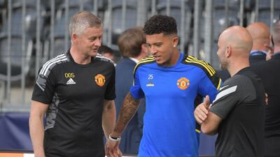 Ole Gunnar Solskjaer and Jadon Sancho. AFP