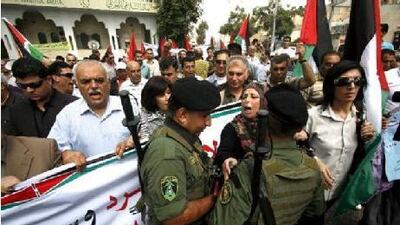 Palestinians protest against the peace negotiations brokered by the US in the West Bank city of Hebron.