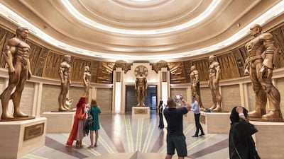 Visitors take snapshots inside the Hall of Justice. Antonie Robertson / The National