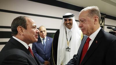 Egyptian President Abdel Fattah El Sisi and his Turkish counterpart Recep Tayyip Erdogan shake hands at the opening ceremony of the World Cup in Doha. EPA
