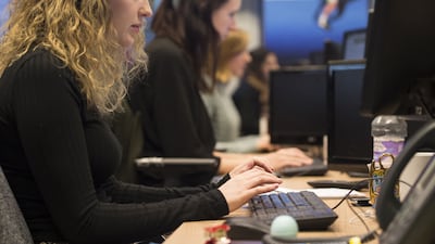 Office workers at their desks in London. PA Wire