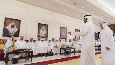 Sheikh Mohammed bin Zayed, second left, at a poetry recital during a group wedding at Majlis Al Bateen. With them are Sheikh Nahyan bin Zayed, Chairman of the Board of Trustees of Zayed bin Sultan Al Nahyan Charitable and Humanitarian Foundation, fourth left, and Sheikh Khaled bin Zayed, Chairman of the Board of Zayed Higher Organisation for Humanitarian Care and Special Needs, fifth left. Mohamed Al Suwaidi / Crown Prince Court - Abu Dhabi