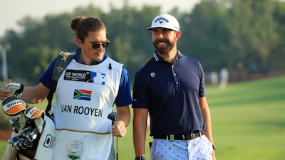 Erik Van Rooyen of South Africa and caddy Alex Gaugert on the 18th green. Getty