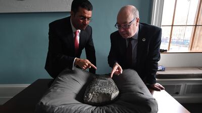 Iraqi Ambassador to the UK Salih Husain Ali (L) and British Minister of the Middle East and North Africa Alistair Burt with an Iraqi 'kudurru' at the British Museum in London. EPA
