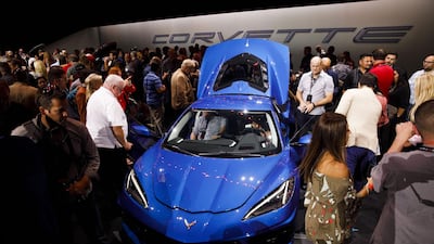 Attendees look at a new Corvette Stingray during the unveiling event. Bloomberg