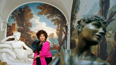 Lollobrigida with two of her sculptures in her Rome villa in 2006. Reuters