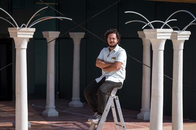 Artist Hussein Nassereddine with his work, which is inspired by the tradition of how Arabian poets described new palaces to the public. Warehouse 421