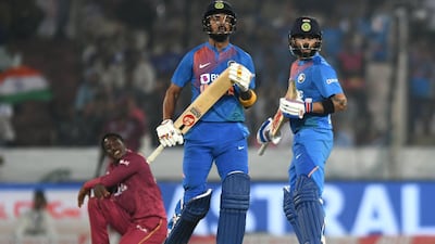 Virat Kohli, right, and KL Rahul hit sparkling fifties to secure victory against the West Indies at the Rajiv Gandhi International Cricket Stadium. AFP