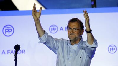 Mariano Rajoy waves to supporters at PP party headquarters after Spain’s general election in Madrid. Despite winning the elections, the second in six months, the incumbent prime minister may have a tough time forming a coalition. Marcelo del Pozo / Reuters