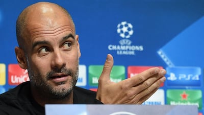 Pep Guardiola speaks to the media ahead of Manchester City's Uefa Champions League match against Feyenoord. Oli Scarff / AFP