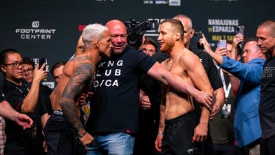 UFC president Dana White separates Charles Oliveira and Justin Gaethje during their face off at the weigh-in for UFC 274. Reuters
