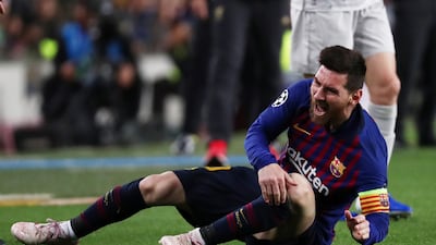 Barcelona's Lionel Messi on the floor after being fouled. Reuters