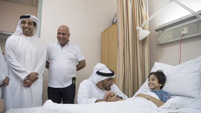 Sheikh Mohammed bin Zayed, Crown Prince of Abu Dhabi and Deputy Supreme Commander of the Armed Forces, and Sheikh Mansour bin Zayed Al Nahyan, Deputy Prime Minister and Minister of Presidential Affairs, visit Hamad Al Mansoori at Khalifa Hospital. Him and his sister are receiving psychiatric care to help them cope with the loss of their mother in a knife attack in Fujairah last week. Hamad Al Kaabi / Crown Prince Court - Abu Dhabi