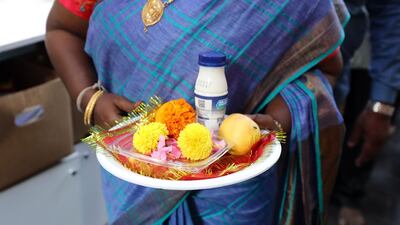 People bring plates with food and flowers to the Shiva Temple during Diwali in Bur Dubai on Saturday, October 26, 2019. Chris Whiteoak / The National