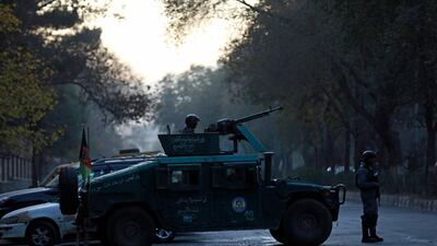 Afghan police patrol at the site of an attack at Kabul University in Kabul. AP Photo