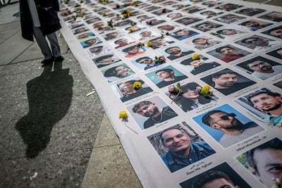 Portraits of slain Iranian protesters are displayed during a demonstration against the Iranian regime on the sideline of the 61st session of the UN Human Rights Council in Geneva on February 23, 2026. AFP