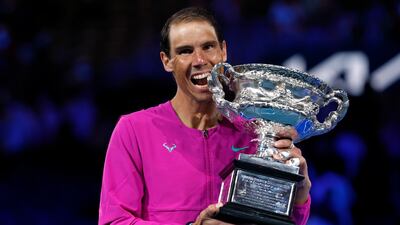 Rafael Nadal of Spain holds the Norman Brookes Challenge Cup after defeating Daniil Medvedev of Russia in the men's singles final at the Australian Open tennis championships in Melbourne, Australia, early Monday, Jan. 31, 2022. (AP Photo / Hamish Blair)