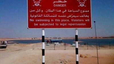A 'no swimming' sign has been placed at the entrance of Lake Tilapia, and new fences are being built around the lake, following the drowning of two people in the last few months.