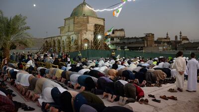 Prayers are held to observe the birthday of the Prophet Mohammed in the courtyard of Al Nouri mosque, Mosul, Iraq.