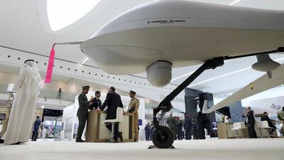 Visitors look at the Drone at the General Atomics Aeronautical stand on the first day of the UMEX held at ADNEC in Abu Dhabi. Pawan Singh / The National