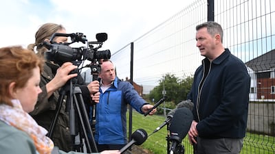 Sinn Fein MP John Finucane talks to the media at the scene. Getty Images