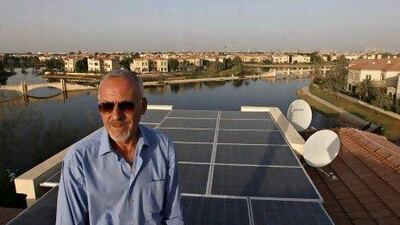 Tony Caden on the roof of his Jumeirah Islands home, where he has installed 38 solar panels. Jeff Topping / The National