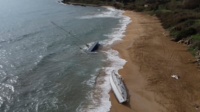 Sailboats used by smugglers to transport migrants and refugees are left abandoned on a beach in southern Italy. AP