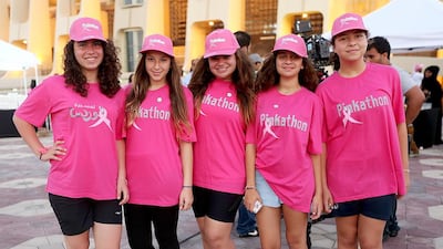 People young and old turned out for Abu Dhabi Media's Pink Walk at Zayed Sports City on Friday night. Among them were, from left to right, Haya Jadayel, Ralda Mansouri, Layan Abdul Khalik, Rita Diab and Jana Jadayel, who was inspired to turn out as a result of her friend's mum's cancer battle. Satish Kumar / The National