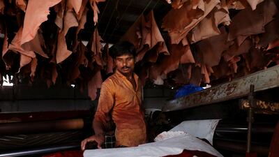 A man prepares animal hides at a tannery in Mumbai, India. Reuters