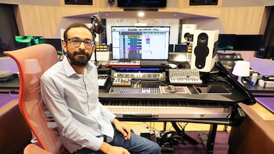Navneeth Balachanderan, the studio engineer who leads the sound section, in the high-tech control room at the studio. Pawan Singh / The National