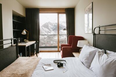 Rooms are neutral-toned, sleek and timber-clad. Courtesy Rooms Kazbegi