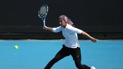 Meshkatolzahra Safi plays a forehand to Anja Nayar. Getty Images