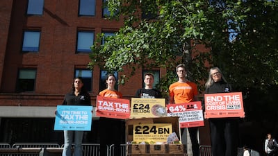 Protesters demonstrate against taxing the super-wealthy outside Number 10 North in Manchester, England last month. Getty Images