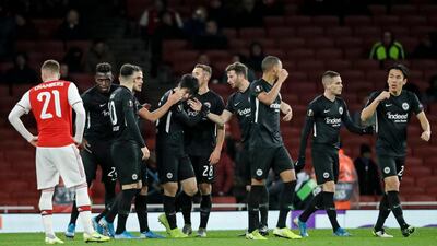 Frankfurt's Daichi Kamada, centre, is congratulated by teammates after scoring his side's first goal at the Emirates. AP