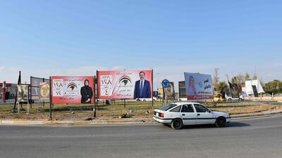 A picture taken on April 14, 2018 in the multi-ethnic northern Iraqi city of Kirkuk shows campaign billboards for candidates in the upcoming parliamentary elections. Marwan Ibrahim / AFP