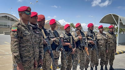 Members of the Ethiopian National Defence Force stand in front of Mekelle's airport after federal forces retook control of Tigray's capital. AFP
