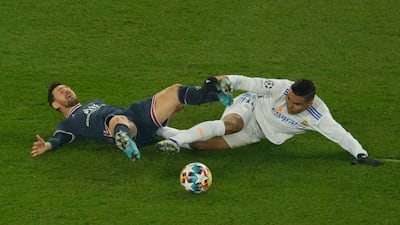 PSG's Lionel Messi is fouled by Real Madrid's Casemiro. AP